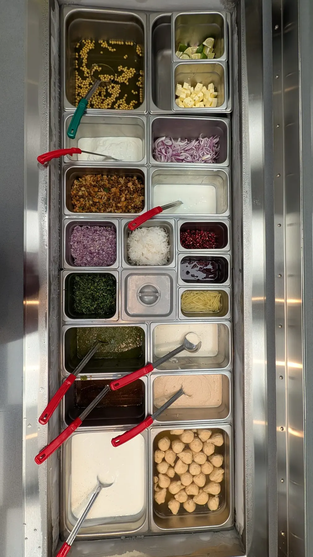 Chutneys, onions and sev at the Sitara chaat station